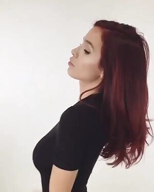 Playing with her hair