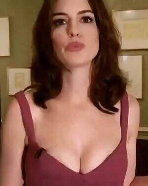 Anne Hathaway Giving A Sweet Kiss And Plenty Of Cleavage